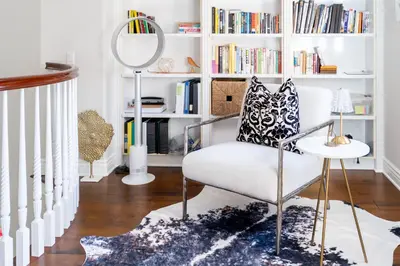 a white room with a chair and a mirror at Escape to Luxury Newport Coast Pelican Gated Home in Newport Beach