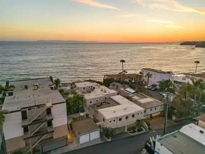 an aerial view of a city and the ocean at sunset at Laguna Villa in Laguna Beach