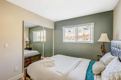 a small bedroom with a bed and a mirror at Sunny Vista Vacation Rental Home 12 Mi to Beach! in Vista