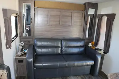 a leather couch sitting inside of a motor home at RV quiet place in the mountain in Hemet