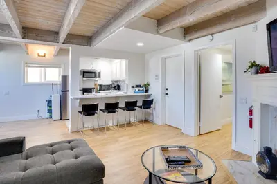 a living room with a couch and a table at Newport Beach Vacation Rental Near Beach and Pier in Newport Beach