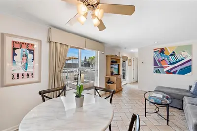 a living room with a table and a couch at Villa Calypso in Laguna Beach