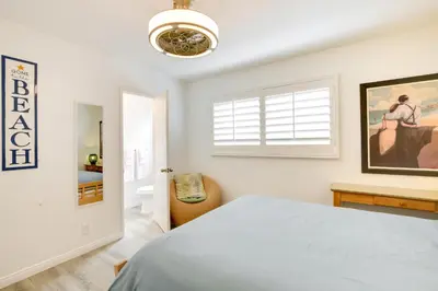 a white bedroom with a bed and a window at San Diego Home with Deck Walk to Mission Beach! in San Diego