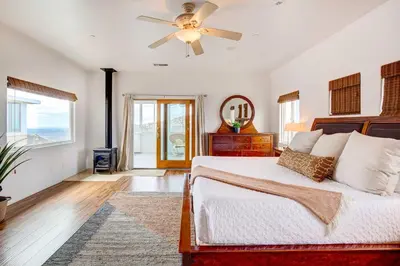 a bedroom with a bed and a ceiling fan at Mountaintop Ramona Home Private Pool, Near Lake! in Ramona