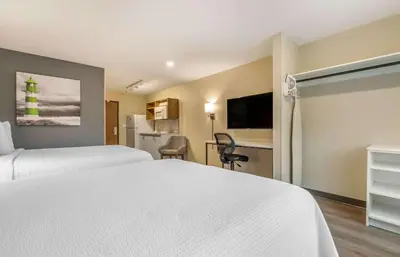 a hotel room with two beds and a kitchen at Extended Stay America Premier Suites - San Diego - San Marcos in San Marcos