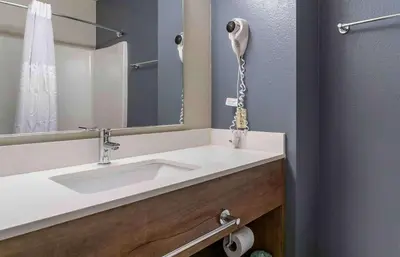 a bathroom with a sink and a mirror at Extended Stay America Premier Suites - San Diego - San Marcos in San Marcos